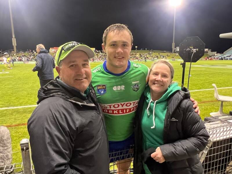 Henderson is joined by his parents, Peter and Lynette, after his NSW Cup debut for Canberra. Picture supplied