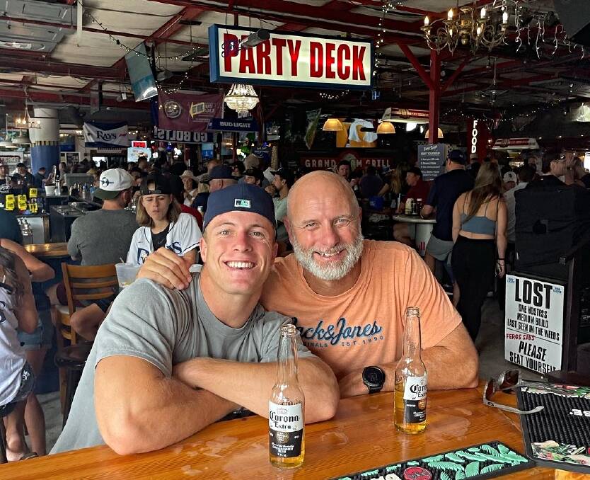 Jack Davis shares a beer with his father, Paul, at a bar near the former's home in Largo, Florida, in September, 2023. Picture supplied