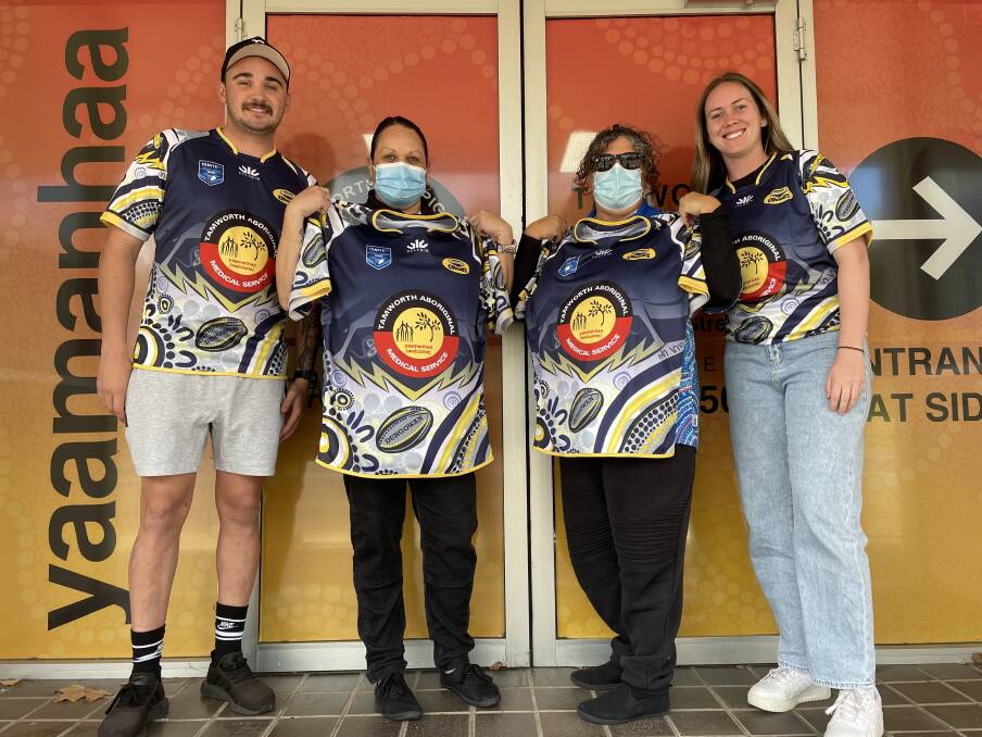 Trent Taylor, Kristi Kirk, Katrina Millgate and Paris Knox unveil Dungowan's Indigenous Round jersey.