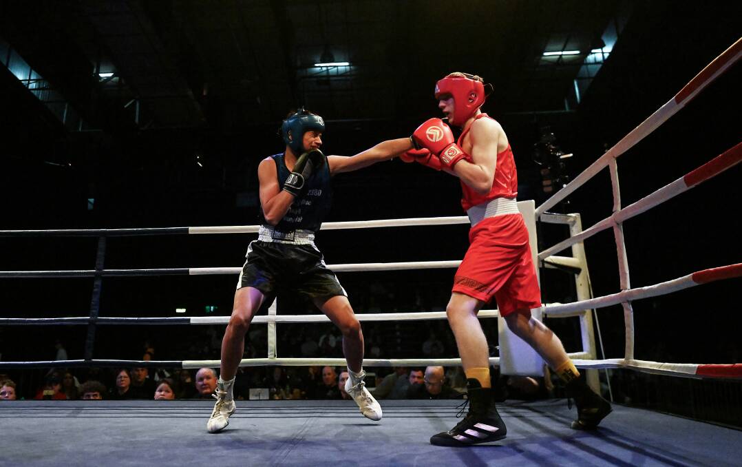 Popplewell, right, duels with Angus Eather. Picture by Gareth Gardner