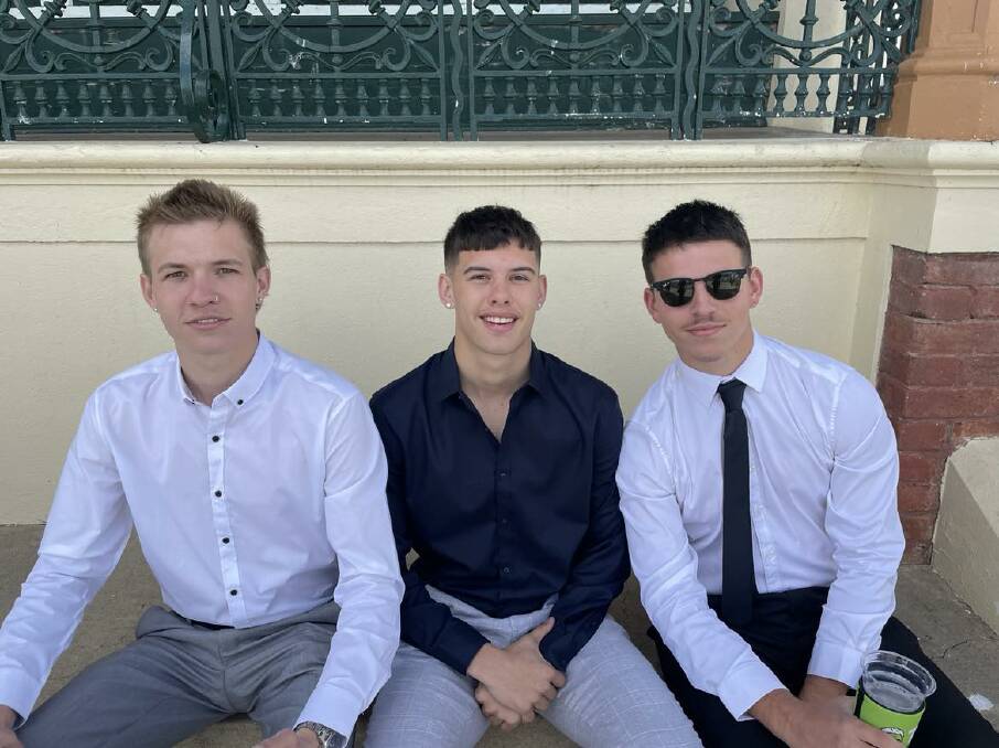 Rzadkowski (right) is joined by mates at the Tamworth races. Picture supplied