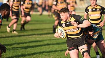 Pirates outside centre Nairn Calder injects himself into the action against the Highlanders. 