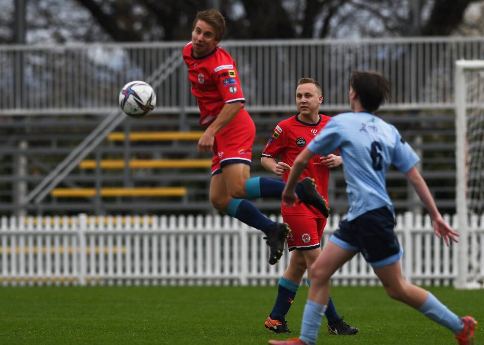 OVA's Riley Russell heads the ball against Tamworth FC at Scully Park on Saturday. Picture by Gareth Gardner 