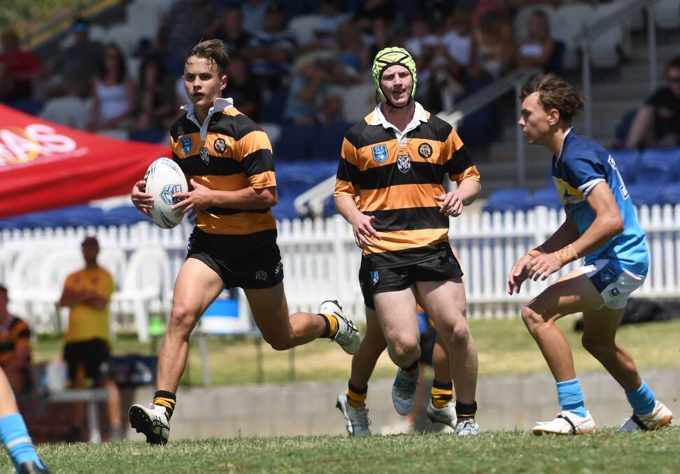 Henderson harasses the Titans in the Tigers' 42-20 win at Scully Park last month. Picture by Gareth Gardner