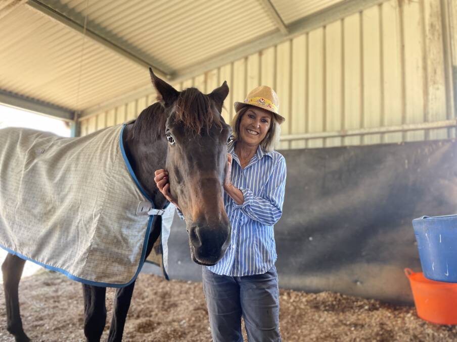 'I CALL HIM BAR': Michelle Fleming and Manabar at her Kootingal property on Sunday morning. Photo: Mark Bode