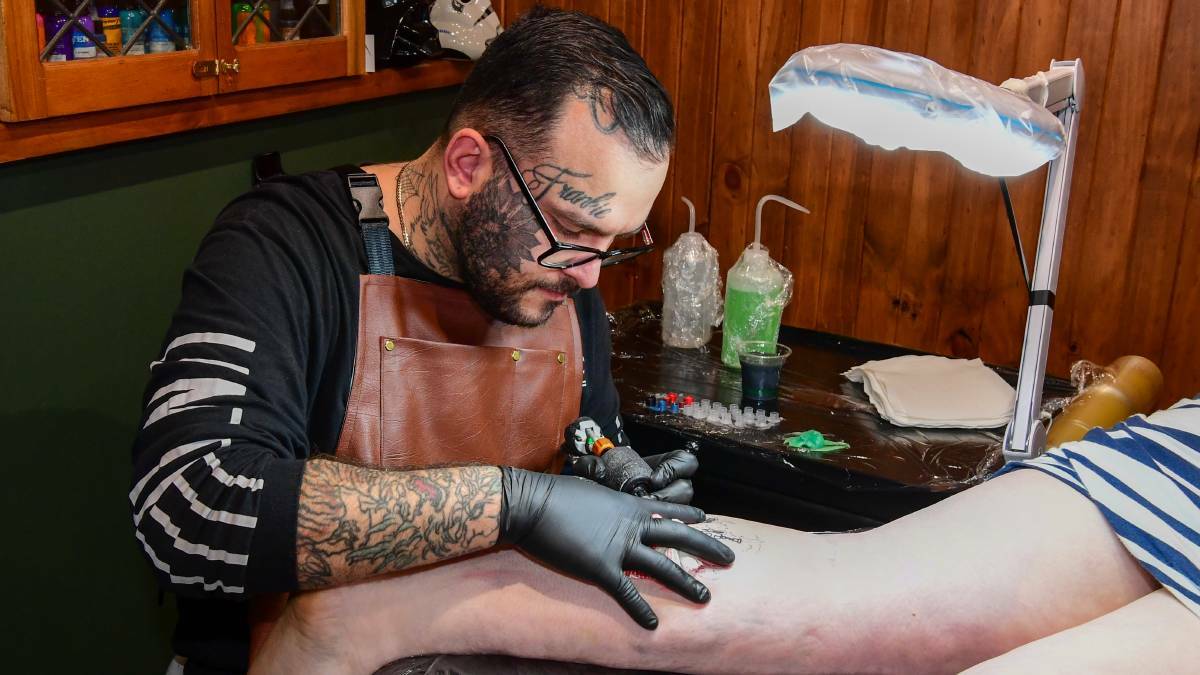 A Woman Lying on the Table and Waiting for a Tattoo Master To Draw a Tattoo  on Her Body Stock Image - Image of sophisticated, shape: 282887949