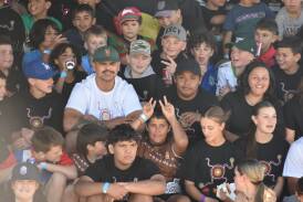 Latrell Mitchell in his element with the hundreds of kids who turned up to the clinic day. 