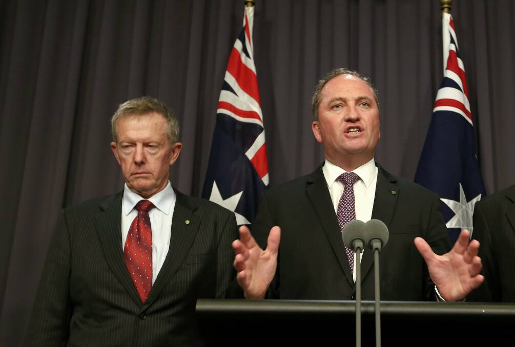Parkes MP Mark Coulton at a press conference with Member for New England Barnaby Joyce in 2014. Picture by Alex Ellinghausen