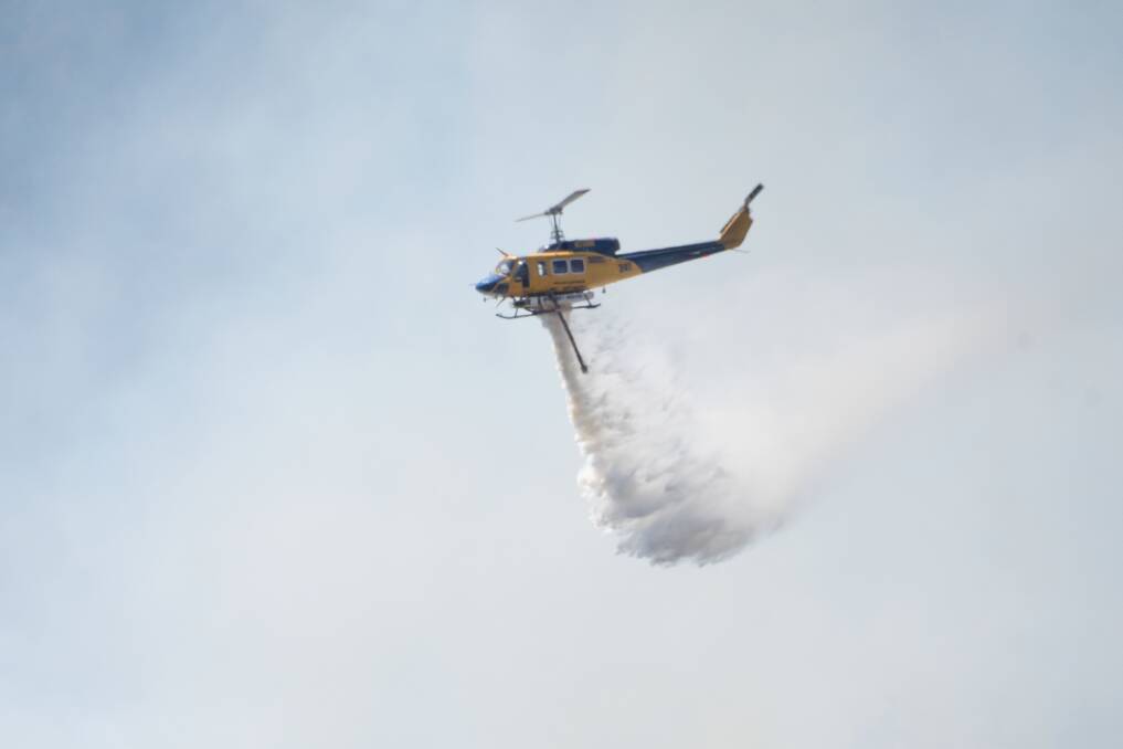 Firefighters have been fighting the blaze near Tamworth from the air and on the ground. Pictures by Peter Hardin, supplied by RFS