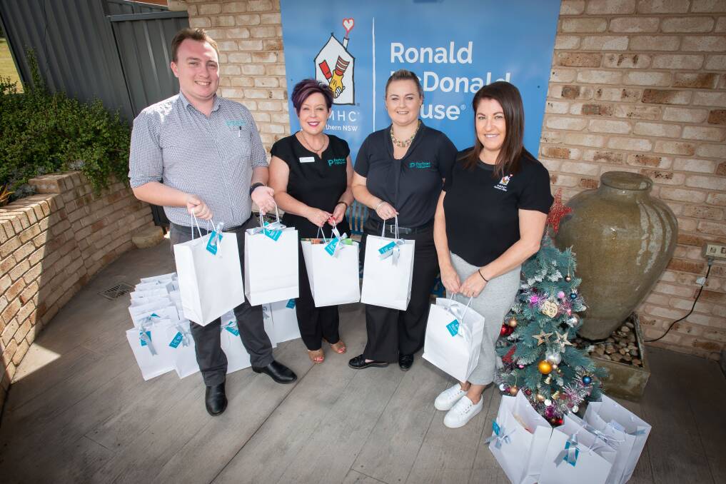 George Powell, Tania Clare, Emily Crompton and Rhiannon Curtis at Ronald McDonald House in Tamworth on Wednesday. Picture by Peter Hardin