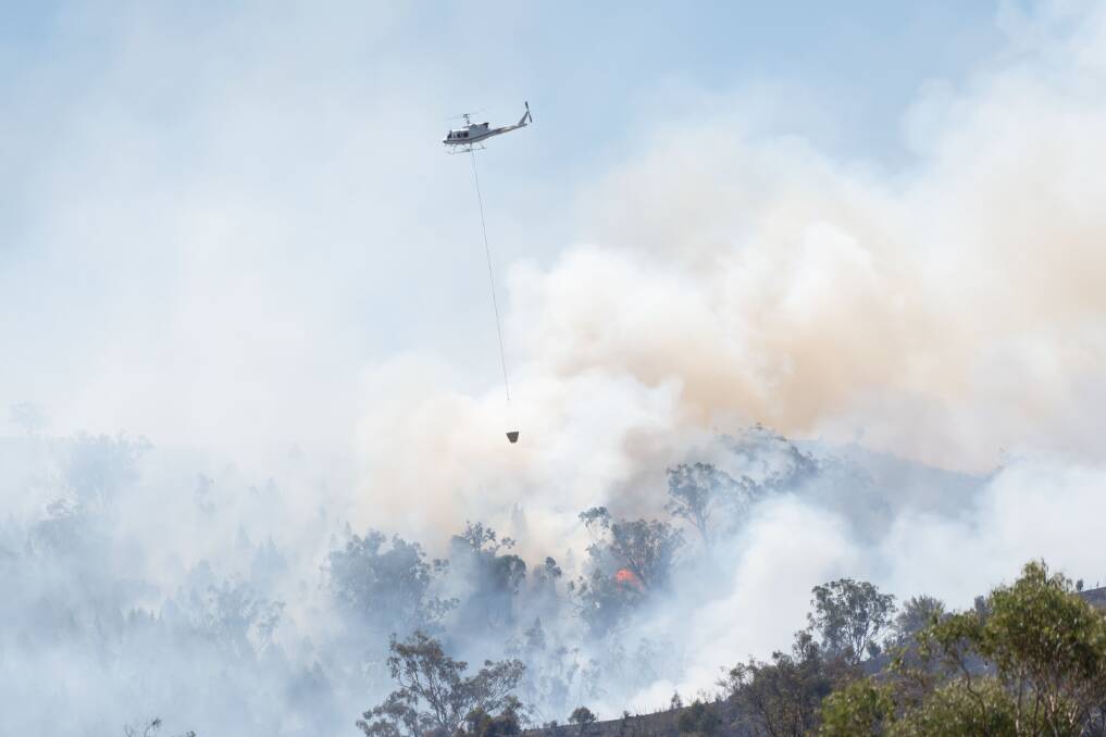 Helicopters and on-the-ground crews have been fighting the blaze. Picture by Peter Hardin