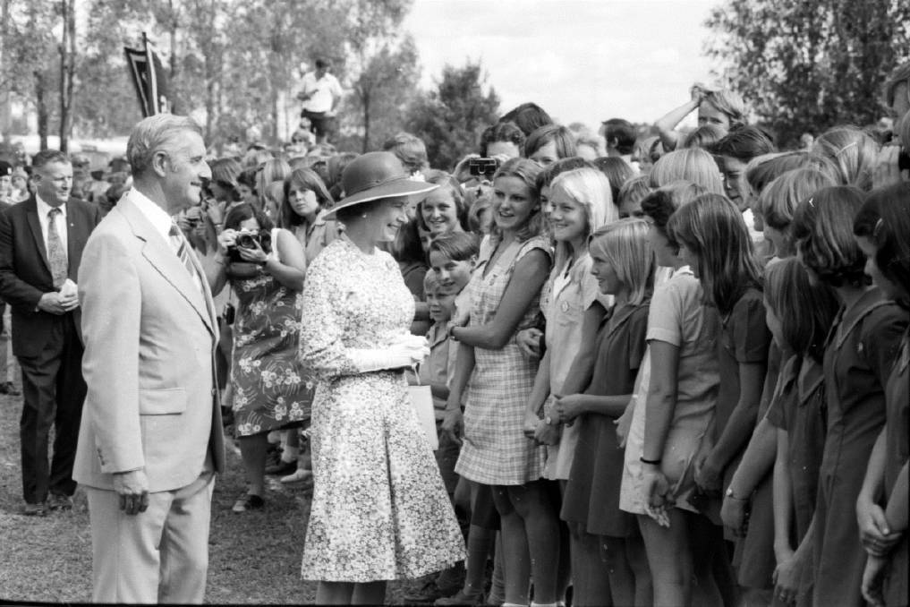 Katrina Telfer speaks with Queen Elizabeth II and Prince Philip in Tamworth in 1977, while two of her sisters and her brother watch on. Picture by the Leader
