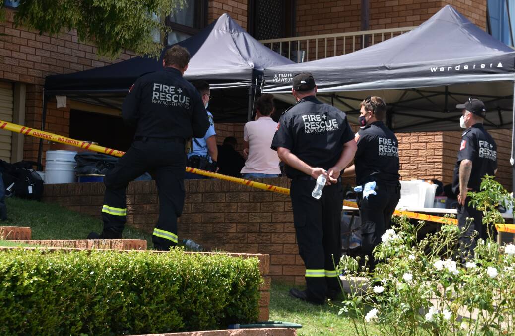 Specialist police officers and the Hazmat unit were called in to help after the raid allegedly uncovered a drug laboratory in Oxley Vale. Picture by Andrew Messenger