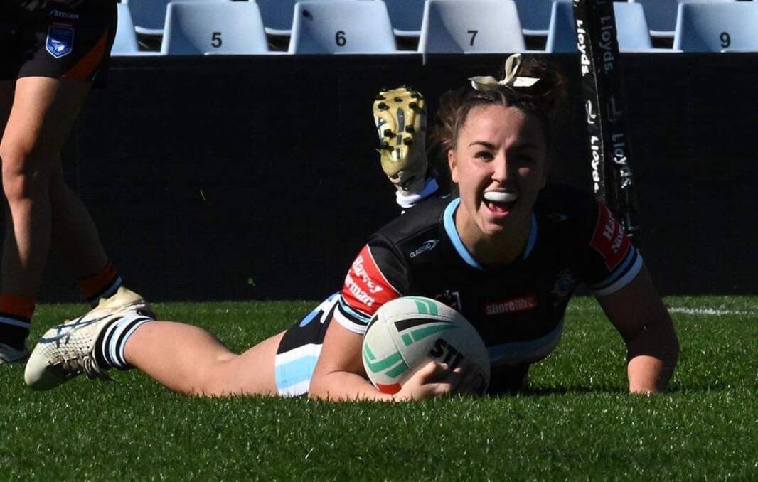 Jada Taylor celebrates her first try in Sharks colours on Saturday against the Wests Tigers. Picture by Cronulla Sharks.