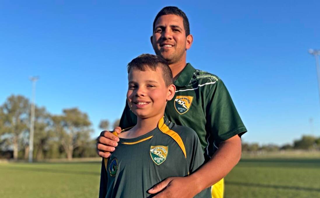 Andre Caetano and his son, Erik, enjoy the late-afternoon sunshine at Johnson Oval after Souths' final game of the year. Picture by Zac Lowe.
