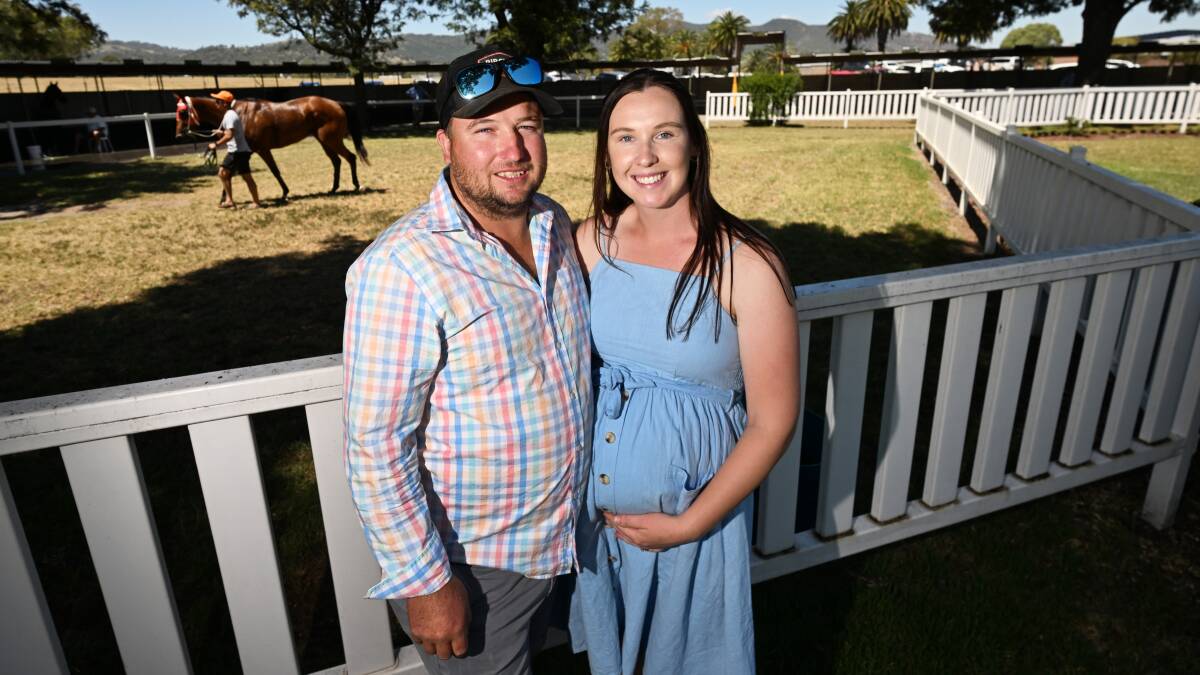 Collins with his partner, Sarah, at the Dungowan Cowboys' season launch in February - shortly before Tilly's arrival. Picture by Gareth Gardner.