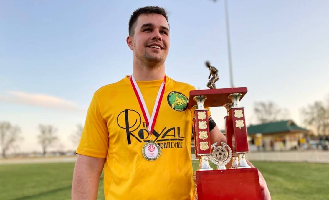 Josh Frost couldn't wipe the smile off his face after leading South Armidale United to the premier league first grade title on Saturday. Picture by Zac Lowe.