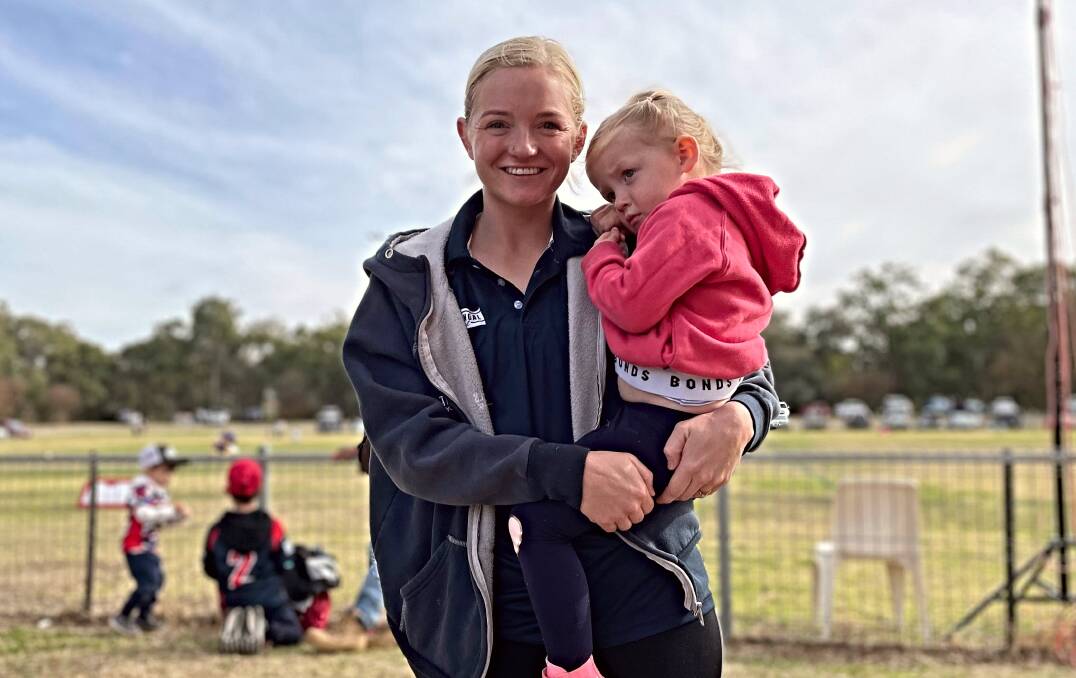 Abby Schmiedel and her daughter, Ruby, shortly after the Roosters' 50-point win on Sunday. Picture by Zac Lowe.