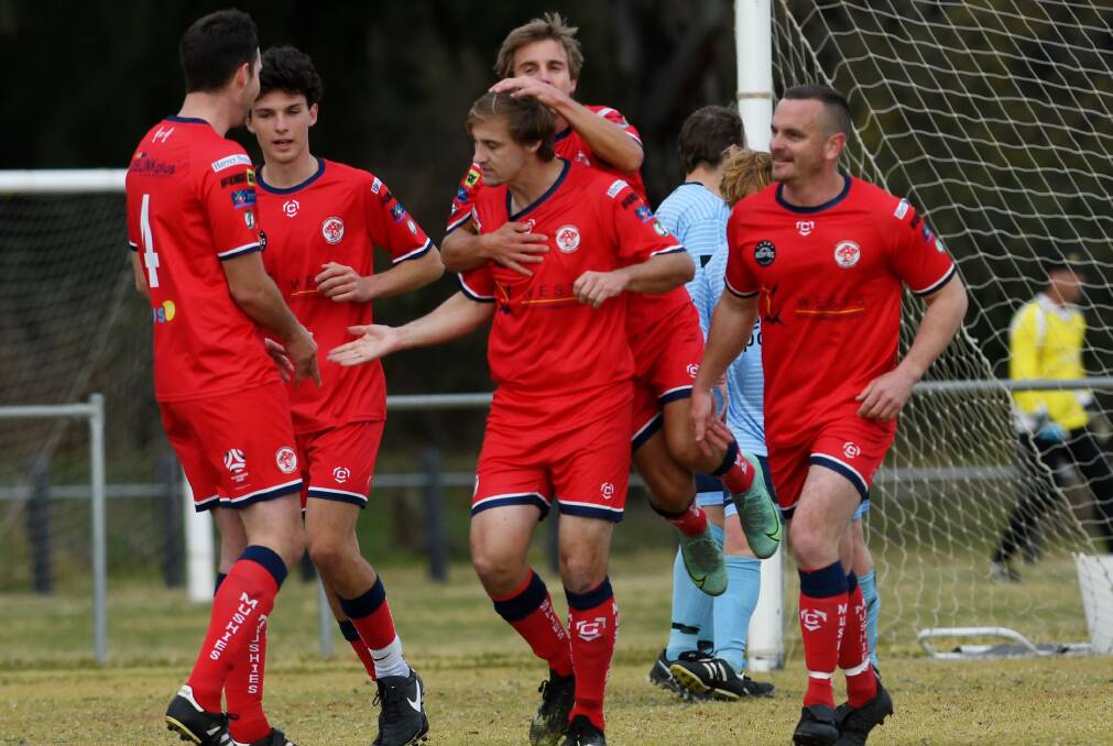 Mitch O'Keefe (centre, pictured after scoring in 2022), was one of three to kick a goal for OVA against Bellingen. Picture by Gareth Gardner. 