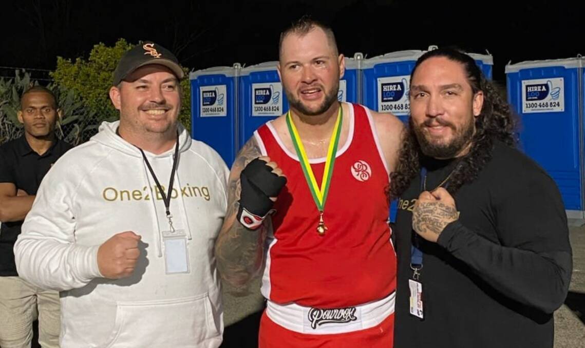 Jarrod Denman (centre) with coaches Jamie Carroll (left) and Anthony Rogers in Queensland. Picture by One2Boxing Westside. 