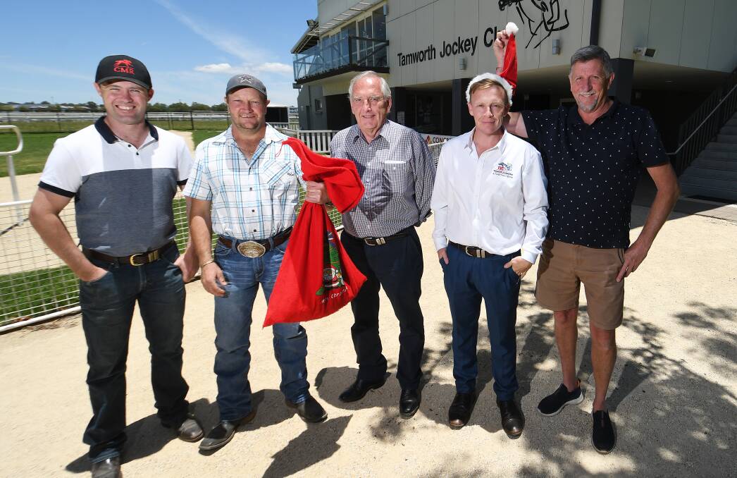 (From left) Local trainers Cody Morgan and Troy O'Neile, Tamworth Jockey Club president Keith Harris, general manager Michael Buckley, and vice president Ray Nicholson celebrate the Christmas season. Picture by Gareth Gardner. 
