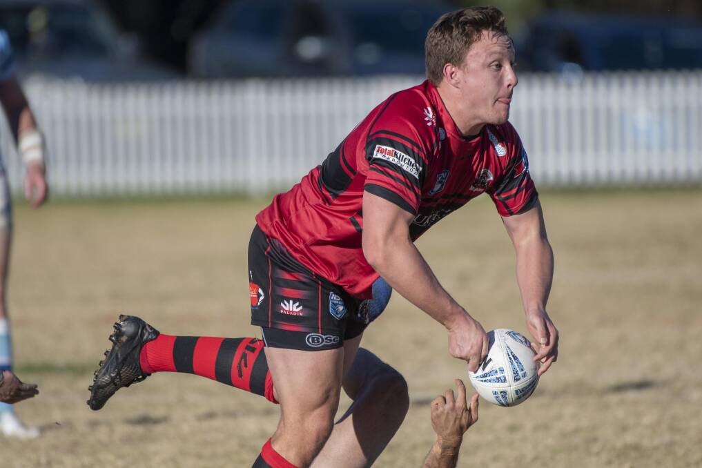 Offload: The North Tamworth Bears did not win their trial match on the weekend but took valuable lessons from the clash against Denman. Photo: Peter Hardin.