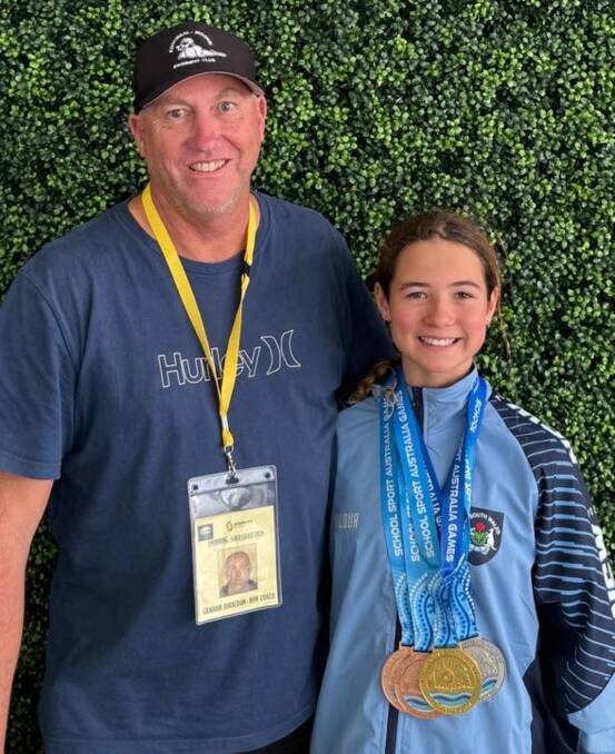 Kootingal Moonbi Swimming Club coach Graham Johnstone with Ruby Rule after her stunning medal haul on the Gold Coast. Picture supplied.