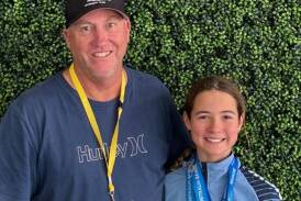 Kootingal Moonbi Swimming Club coach Graham Johnstone with Ruby Rule after her stunning medal haul on the Gold Coast. Picture supplied.