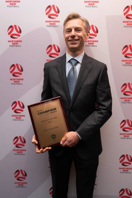 Matt Hall proudly bears his Referee of the Year award at the Northern NSW Football awards night recently. Picture supplied.