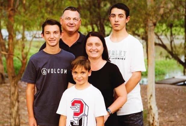 Paul Raveneau, seen here with with his wife, Stacey, and sons, Bryce, Layne and Peyton, left an indelible mark on the Moree Boars. Picture supplied.