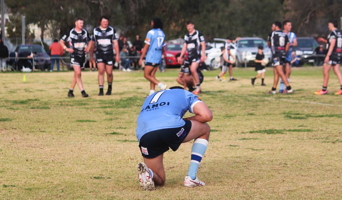 Josh Trindall sinks to a knee momentarily after the Narrabri Blues' narrow loss to Werris Creek on Sunday. Picture by Zac Lowe.