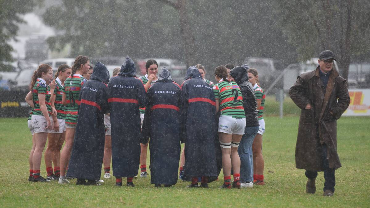 The rain bucketed down during the women's clash.