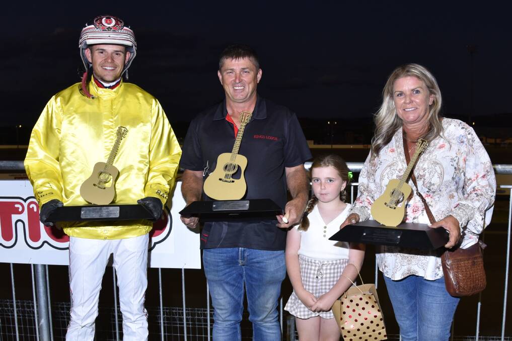 The winning connections of Surf Ace - reinsman Brendan Barnes, trainer Graham Dwyer and wife Martine and daughter Darcy, with the coveted Golden Guitar trophies. Picture PeterMac Photography
