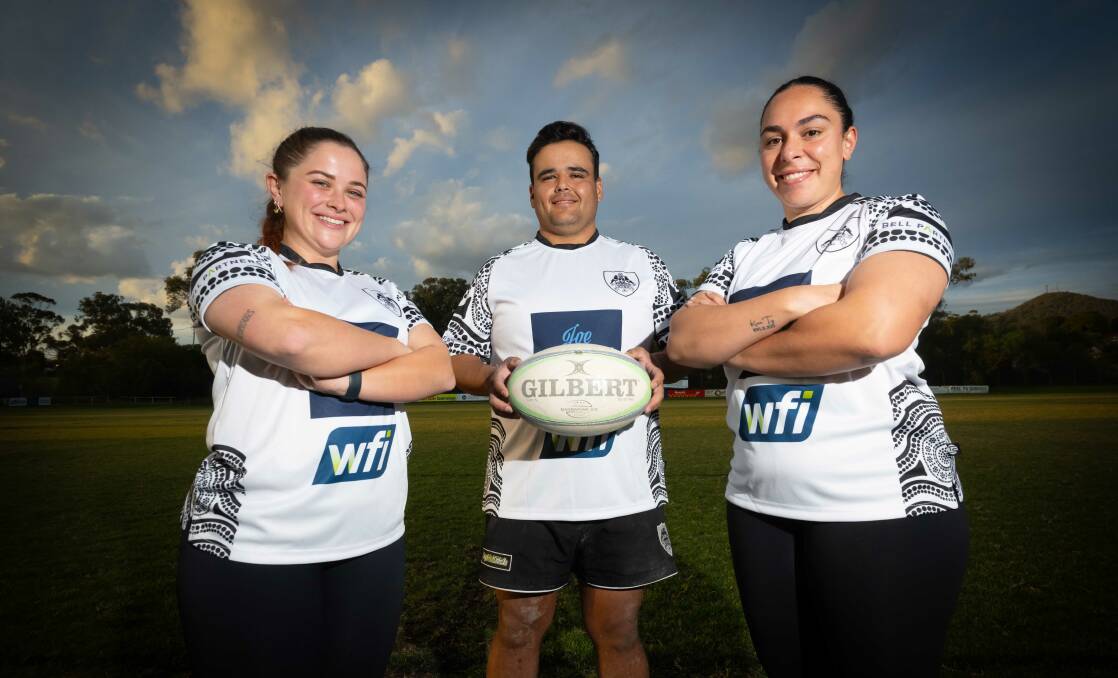 Eliza Bennett, Liam Allan and Tobi-Lee Clough model the special jerseys the Magpies will don for Saturday's second annual Reconciliation Round. Picture by Peter Hardin