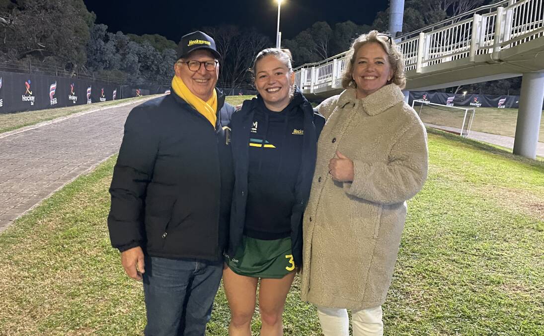 Arnott with proud parents James and Kate.