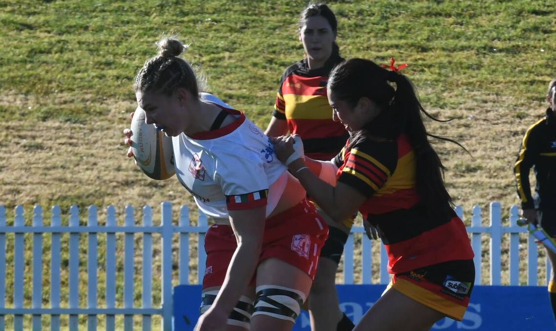 Georgia Moore takes on the Central Coast defence. Picture by Samantha Newsam
