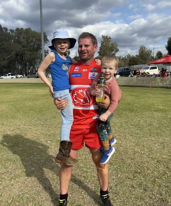 Rowling, pictured here with daughter Freya, 7, and son Boden, 2, was one of the Swans' best in their elimination final win. 