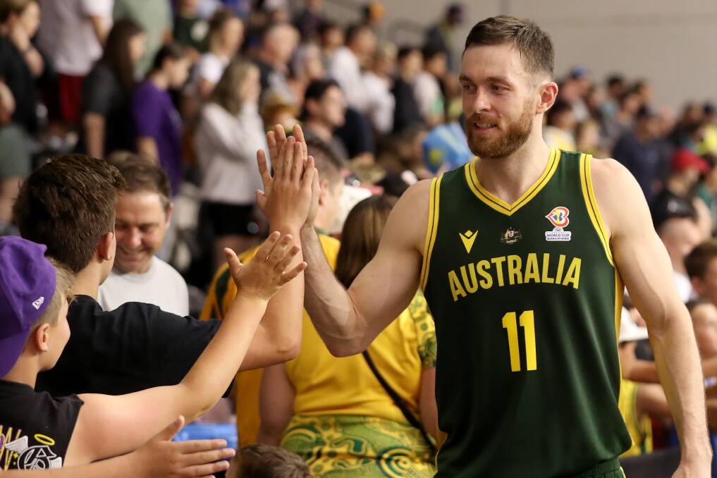 Nick Kay celebrates with fans after leading the Boomers to a 45 point win in their final World Cup qualifier on Sunday. Picture Kelly Defina/Getty Images
