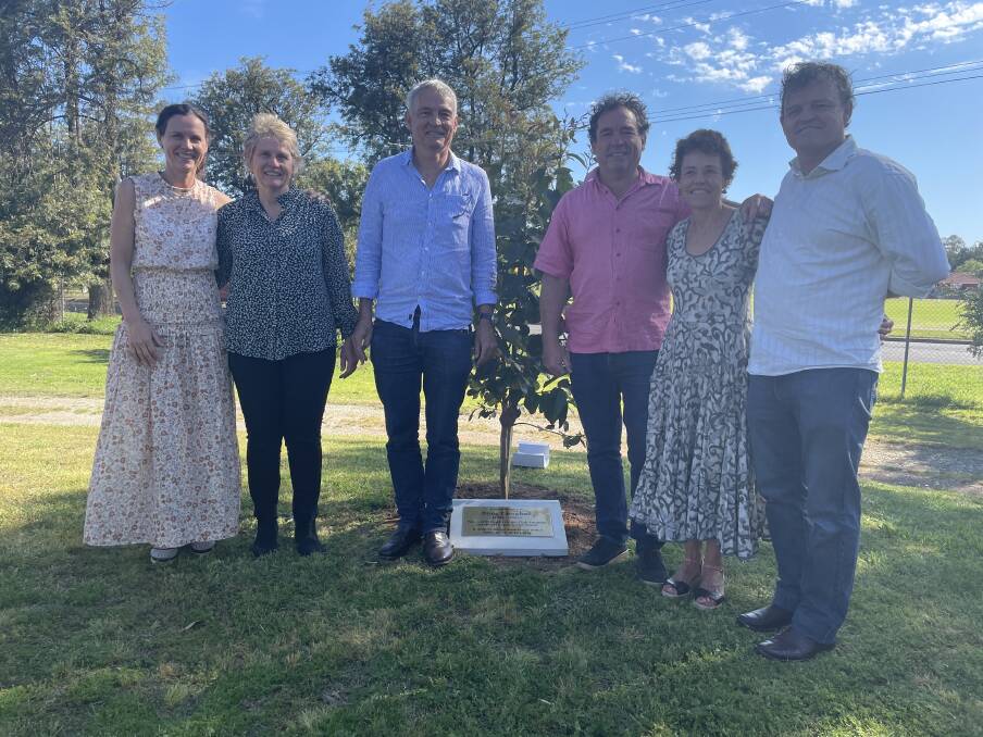 (L-R) Pip Oxenham, Prue Mason, Steve Campbell, Rod Campbell, Fiona Jacoby and Jim Campbell with the plinth and plaque honouring their late father Doug Campbell's legacy.
