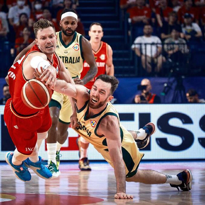 Tamworth's Nick Kay fights with a German opponent for possession during the Boomers loss to Germany. Picture Basketball Australia Facebook