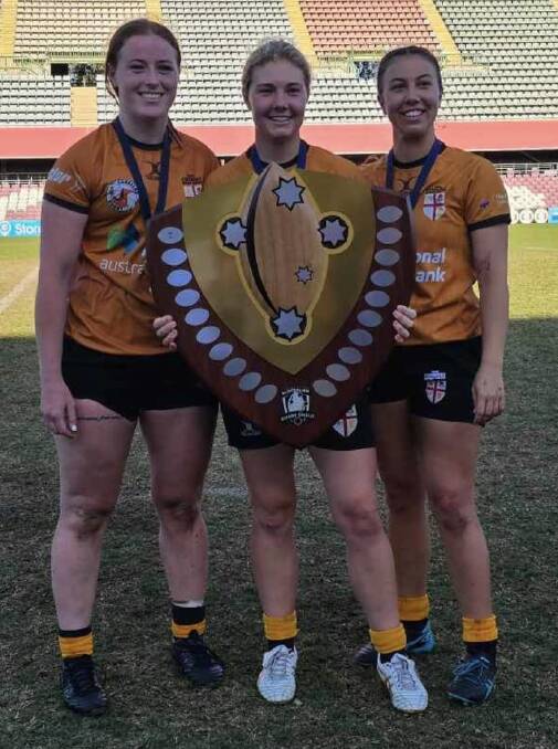 Central North trio Piper Rankmore, Georgia Moore and Emmy Barr with the Australian Rugby Shield. Picture Erin Moore.