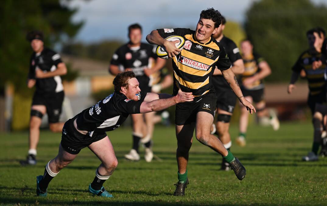 Moree fullback Mitch Adams cling onto Pirates centre Blair Maloney. Picture by Gareth Gardner