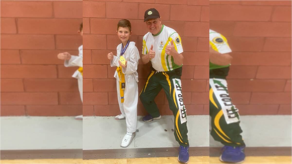 Harrison Kollias, pictured here with Fit-For-It Taekwondo Academy instructor David Jackson, won his division at the Brisbane Open on the weekend. Picture supplied.