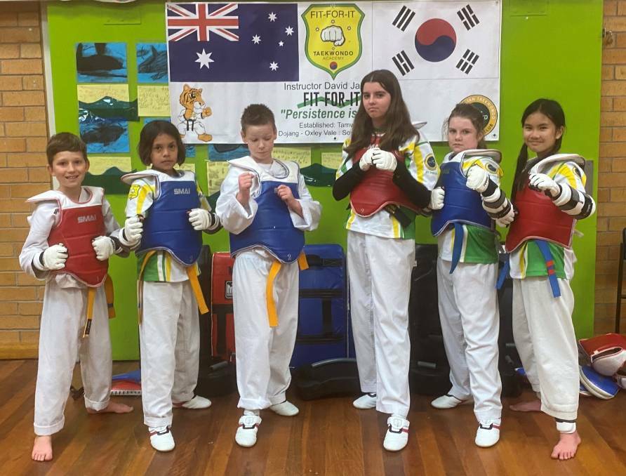 Kollias (left) with the Fit-For-It Taekwondo Academy contingent that competed at last month's state titles.