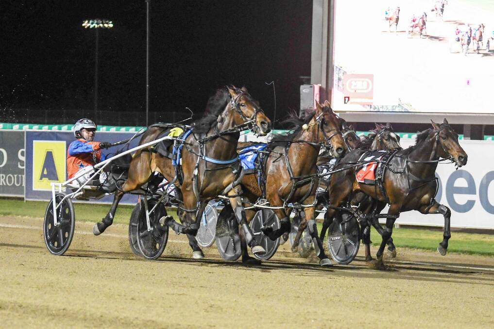 The Jamie Donovan-trained Fast Tracker, with Jack Trainor in the drivers seat, flashes home down the outside to win one of the three Carousel heats at Menangle on Saturday night. Picture Club Menangle.