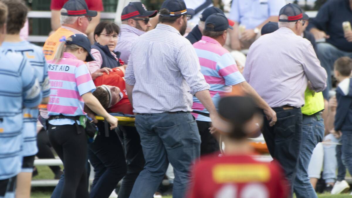McDermott is carried off the field during last year's grand final. Picture by Peter Hardin