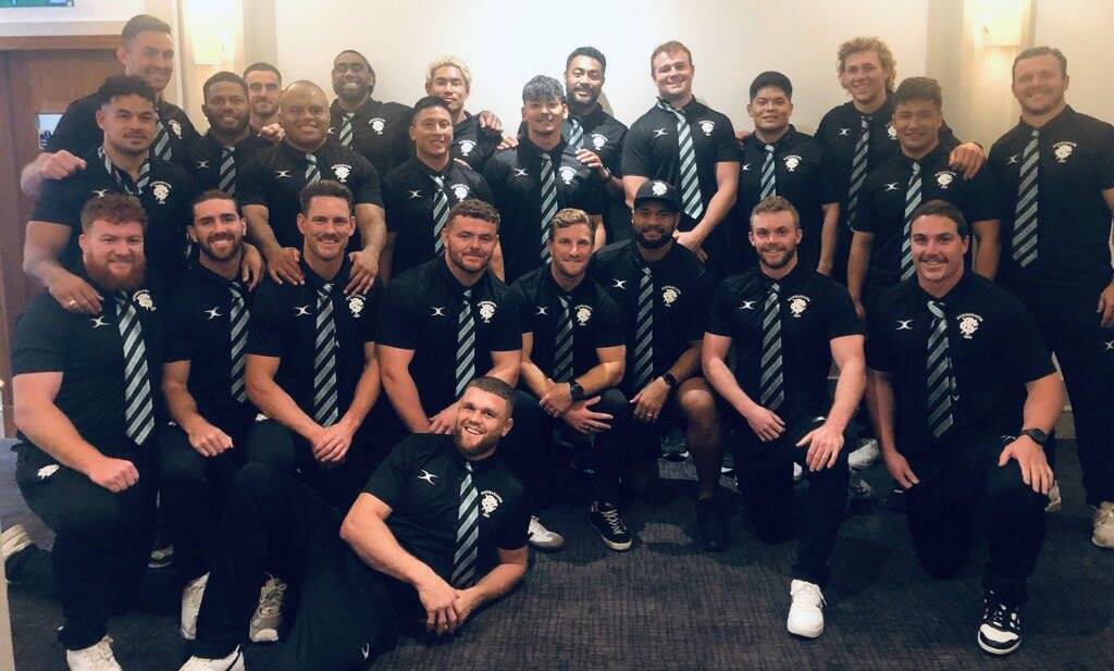 Wilson (back fifth from right) with his Barbarians team-mates ahead of their first game this Saturday night. 