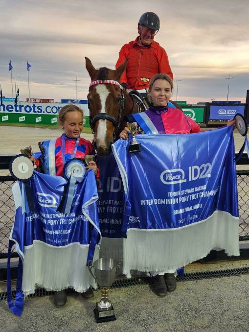 Tamworth mini trotters Reba Brown (left) and Rylee Kiddle (right) show off their winning rugs and trophies from Saturday night's Inter-Dominion finals. Picture by Tanya Welsh