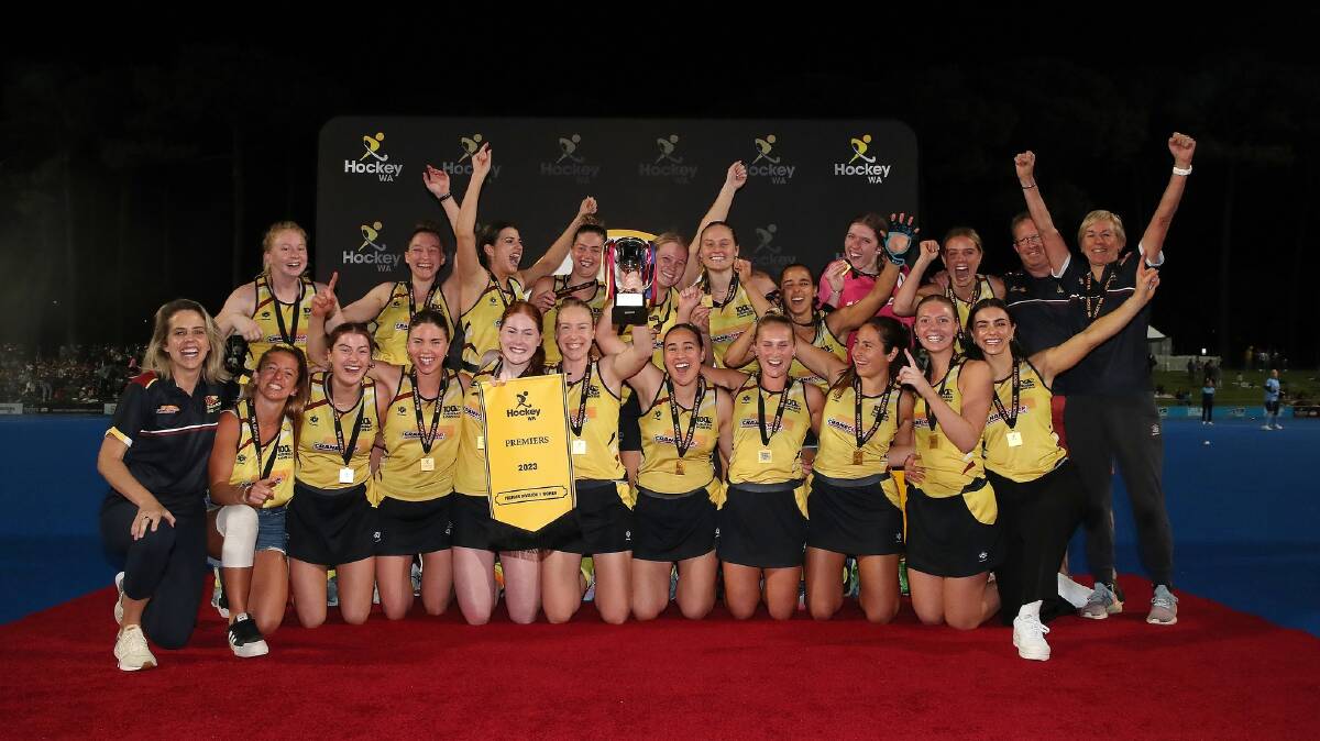 Arnott (back fourth from left) celebrates with her Suburban Lions team-mates after claiming their maiden premiership. Picture WA Hockey