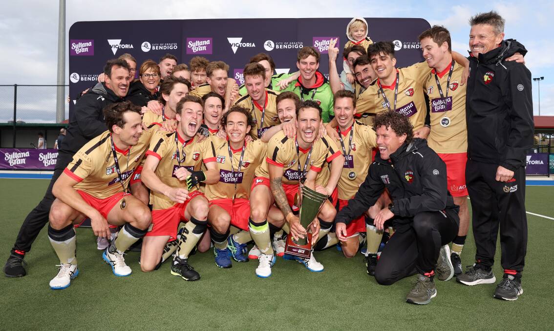 Ehren Hazell (middle) and Nathan Czinner (middle third from left) enjoy Hockey One glory with their NSW Pride team-mates. Picture by Martin Keep/Getty Images